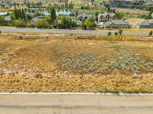 Aerial perspective of suburban area with a large body of water