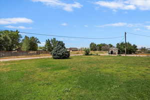 View of yard with an outbuilding