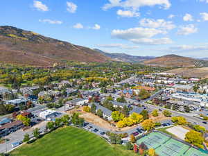 Aerial perspective of suburban area with a mountainous background