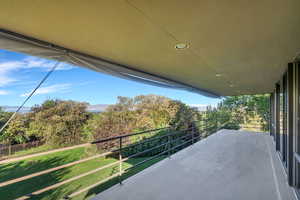Concrete balcony off family room with valley views