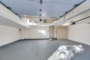 New epoxyed floor in garage with loft storage above