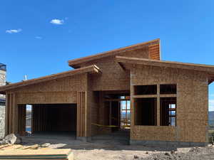 Unfinished property with an exterior structure and an outbuilding