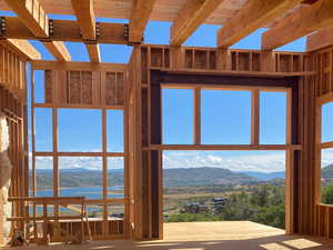 Miscellaneous room featuring a water and mountain view and beam ceiling