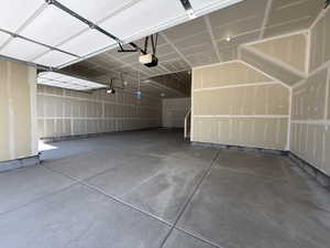 Garage featuring a garage door opener
