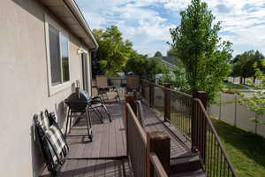 Wooden deck featuring grilling area