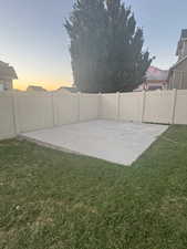 Fenced backyard with a patio