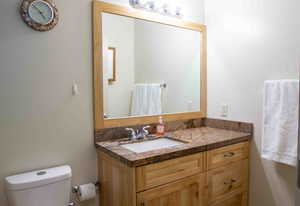 Half bath with toilet and vanity