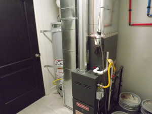 Utility room with heating unit and gas water heater