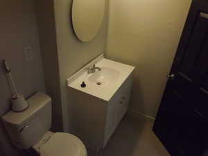 Bathroom featuring vanity and toilet