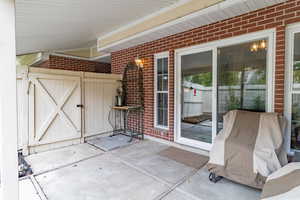 View of patio / terrace with a gate and area for grilling