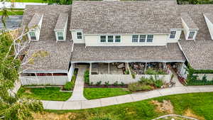 View of front of house featuring roof with shingles