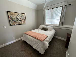 Carpeted bedroom with baseboards