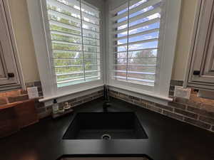 Kitchen view of a sink and backsplash
