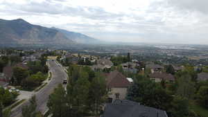 Aerial view of property and surrounding area with mountains