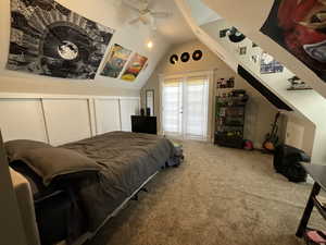 Bedroom with carpet, lofted ceiling, and ceiling fan