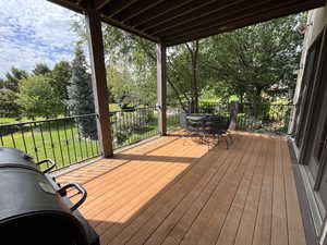 Deck featuring a yard and outdoor dining space