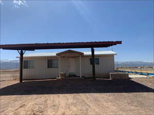 View of outbuilding featuring a mountain view