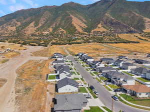 Aerial view of residential area featuring a mountainous background