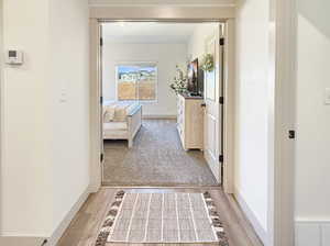 Corridor with light wood finished floors