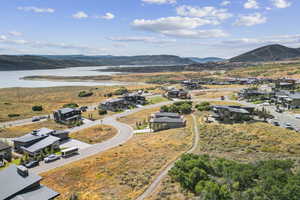 Aerial perspective of suburban area featuring a water and mountain view