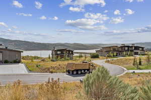 View of home's community featuring a water and mountain view