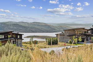 View of mountain backdrop featuring a nearby body of water