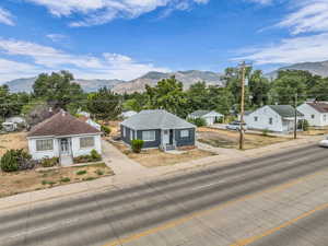View of mountain backdrop featuring nearby suburban area
