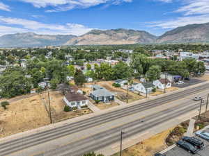 Aerial perspective of suburban area featuring a mountainous background