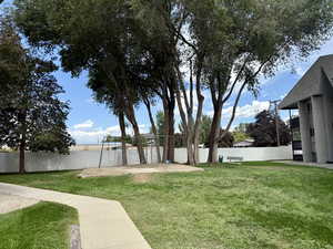 Fenced backyard with a patio