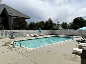 Community pool featuring a patio area