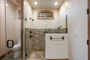 Bathroom featuring a stall shower and recessed lighting