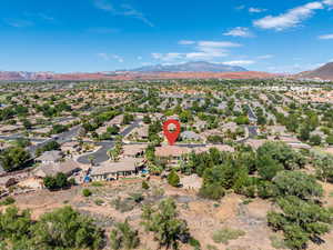 Aerial perspective of suburban area with a mountain backdrop
