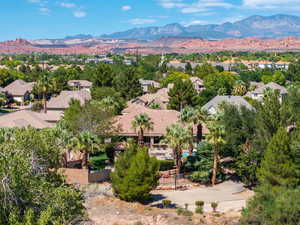 Aerial view of residential area featuring a mountainous background