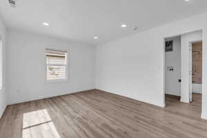 Unfurnished room with recessed lighting and light wood finished floors