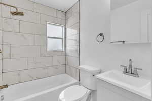Full bathroom with bathing tub / shower combination and vanity