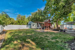 Fully Fenced backyard w Playground