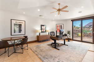 Home office featuring recessed lighting, light tile patterned flooring, and a ceiling fan