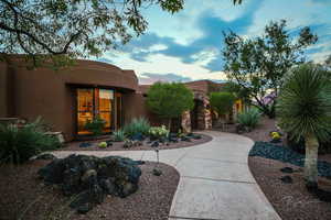 View of front of home featuring stucco siding