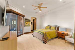 Bedroom with light colored carpet, access to exterior, a ceiling fan, ornamental molding, and recessed lighting