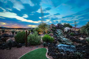 View of yard with a garden pond