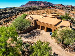 View from above of property with a mountain backdrop