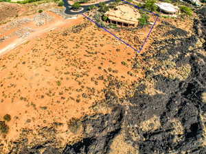 Aerial view of property and surrounding area featuring property parcel outlined