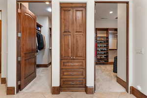 Spacious closet featuring light tile patterned floors