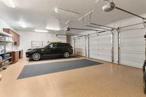 Garage featuring a garage door opener