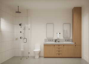 Full bath featuring a shower stall and double vanity