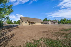 Back of house with a patio area