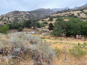 View of mountain background featuring rural landscape