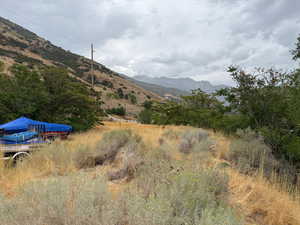 View of mountain backdrop featuring rural landscape