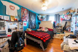 Bedroom with wood finished floors