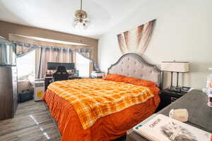 Bedroom featuring ceiling fan and wood finished floors